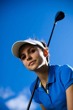 Girl playing golf