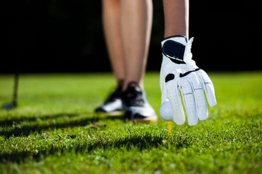 Playing golf, ball