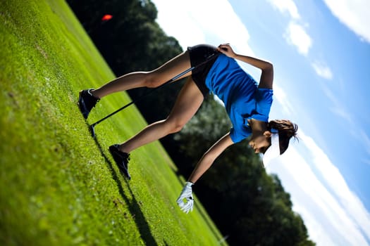 Girl playing golf