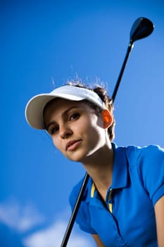 Young woman playing golf