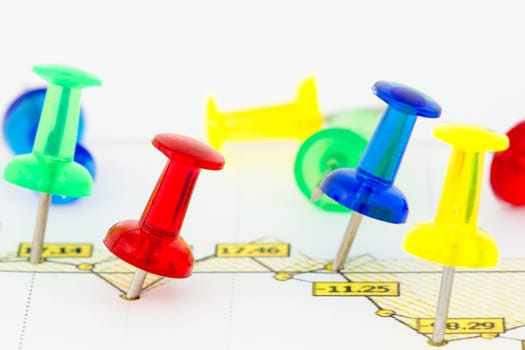 Business growth chart with colorful pins on white background
