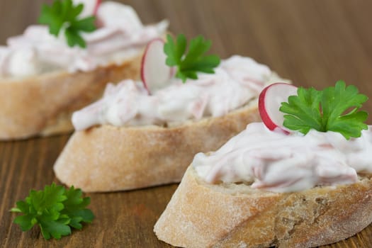 Baguette with sausage salad
