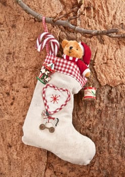 Stuffed gift stocking with nostalgic toys for Christmas
