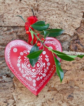 Rustic background with Christmas decorations and holly branches
