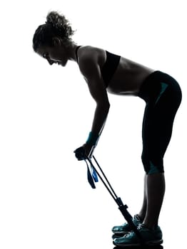 one caucasian woman exercising gymstick  fitness workout posture in silhouette studio isolated on white background
