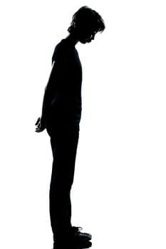 one caucasian young teenager silhouette boy or girl full length in studio cut out isolated on white background