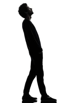one african handsome young man standing looking up surprise   in silhouette studio isolated on white background