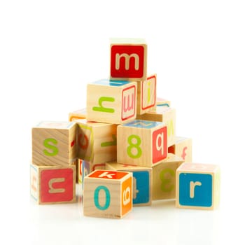 wooden toy cubes with letters. Wooden alphabet blocks.
