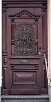 Wooden front door of a home. Old Wooden Door.