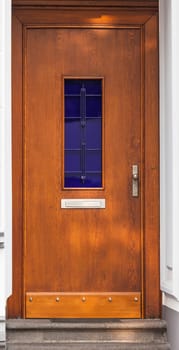 Wooden front door of a home. Old Wooden Door.