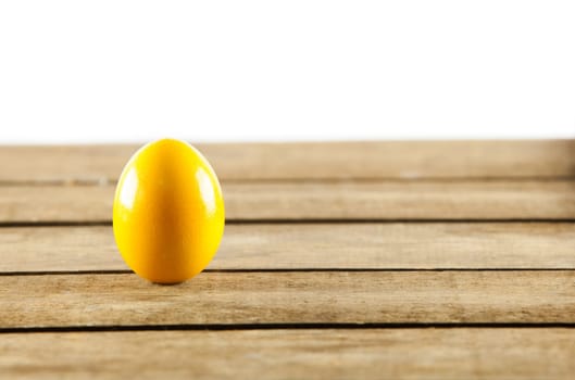 Colorful easter eggs on old wooden background. Easter concept. The colorful painted Easter eggs