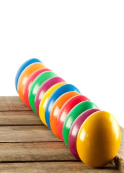 Colorful easter eggs on old wooden background. Easter concept. The colorful painted Easter eggs