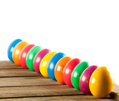 Colorful easter eggs on old wooden background. Easter concept. The colorful painted Easter eggs