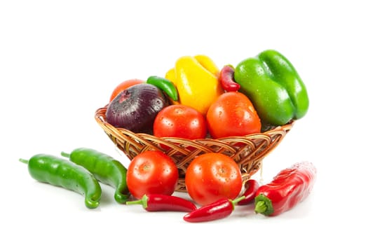Fresh vegetables in basket isolated on white. Bio Vegetable.  Composition with raw vegetables and basket isolated on white