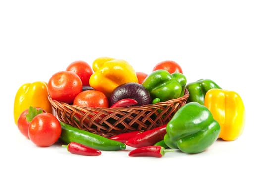 Fresh vegetables in basket isolated on white. Bio Vegetable.  Composition with raw vegetables and basket isolated on white