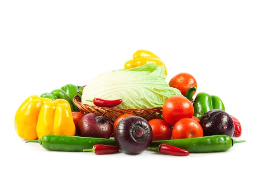 Fresh vegetables in basket isolated on white. Bio Vegetable.  Composition with raw vegetables and basket isolated on white