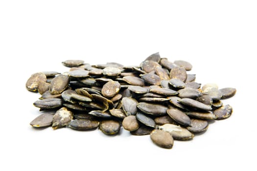 Pumpkin seeds on a white background