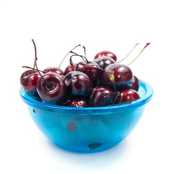 Fresh cherries in bowl isolated on white