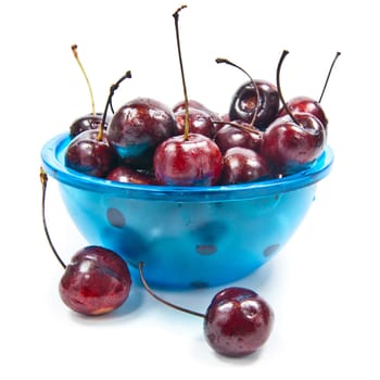 Fresh cherries in bowl isolated on white