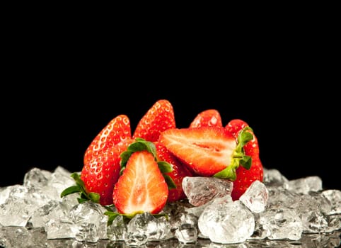 strawberry on black background.  strawberries with ice cubes on a black background. strawberry and ice