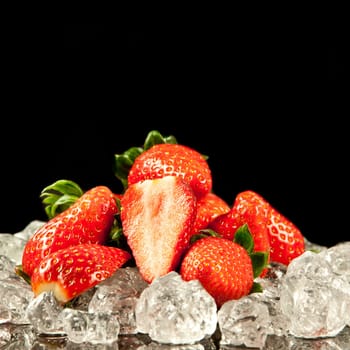 strawberry on black background.  strawberries with ice cubes on a black background. strawberry and ice