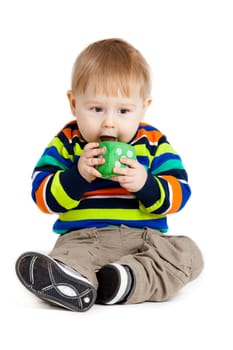 baby is playing with  toys over white background. Funny little kid playing with cup toys