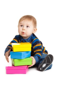 baby boy and gift box isolated on white. Portrait of happy beautiful little boy isolated on white background
