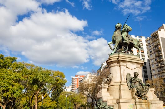 Public statue in a plaza in Buenos Aires with a beautiful sky in the background