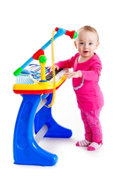 little girl and the keyboard on white background. funny girl. young DJ