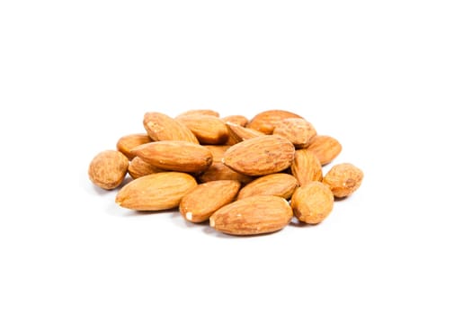 Heap of almond nuts isolated on white background