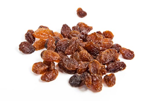 brown raisins on a white background