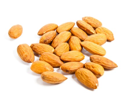 Heap of almond nuts isolated on white background