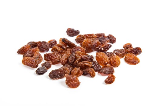 brown raisins on a white background
