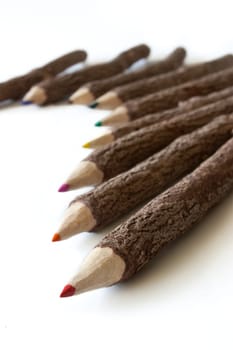 Colored pencils on white background