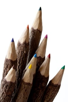 Colored pencils on white background