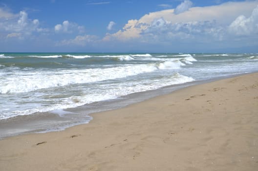 Restless sea on sandy beach Marina di Vecchiano nearby Pisa, Tuscany in Italy