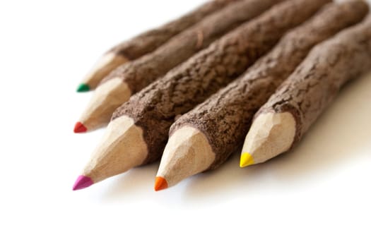 Colored pencils on white background