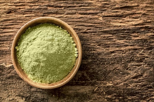 Overhead view of a bowl of finely ground green tea powder, or matcha, used as an Asian beverage especially in Japanese tea ceremonies and also as a flavouring in food