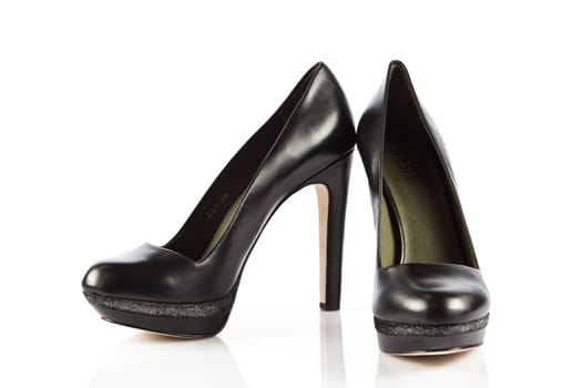 Elegant high heel shoes on white background. Black footwear.