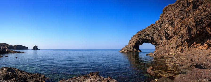 View of Arco dell'Elefante and Faraglioni in the Pantelleria island, Sicily