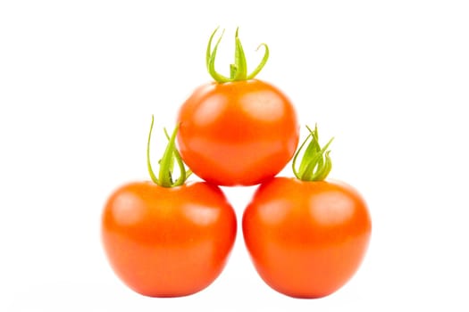 Three tomatoes stacked in pyramid shape