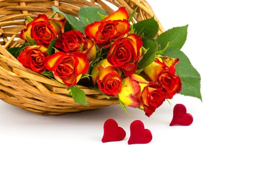 red and yellow roses in a basket