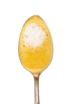Freeguard spoon with carrot soup and coconut milk