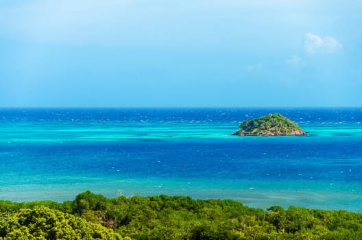 Small island near San Andres y Providencia, Colombia surrounded by turquoise and blue water