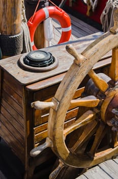 Steering wheel of an old sailing vessel, close up