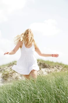 Young woman by the sea