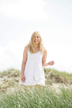 Young woman in the dunes