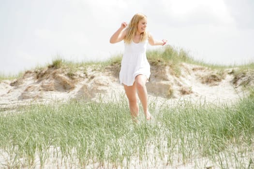 Young woman in the dunes