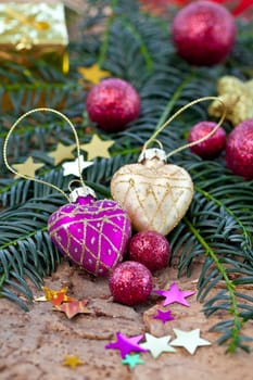 Decoration in purple and gold for Christmas on fir branches