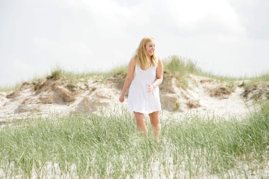 Young woman in the dunes